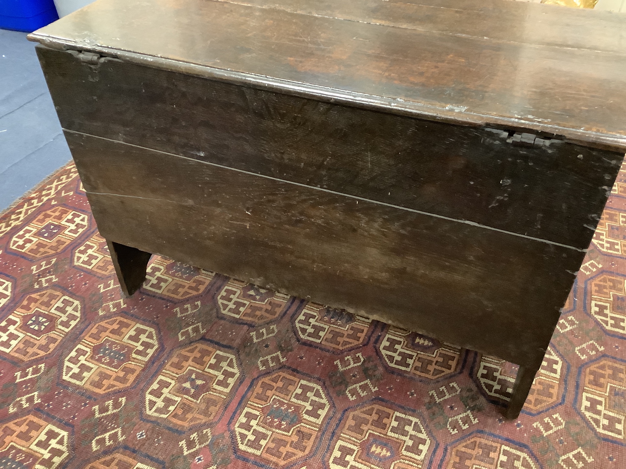 A 17th century carved boarded and panelled oak chest with rectangular moulded top, length 97cm, depth 48cm, height 64cm